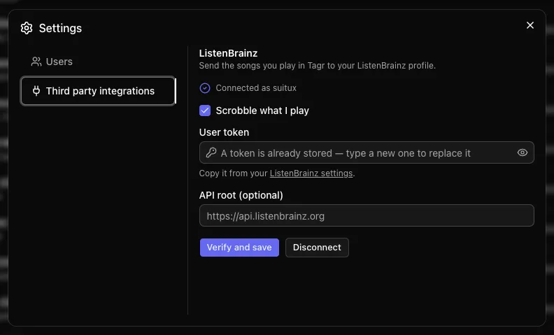 Tagr settings dialog open on the third party integrations section, showing the ListenBrainz connection with a stored user token and an optional API root